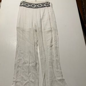 White linen boutique pants